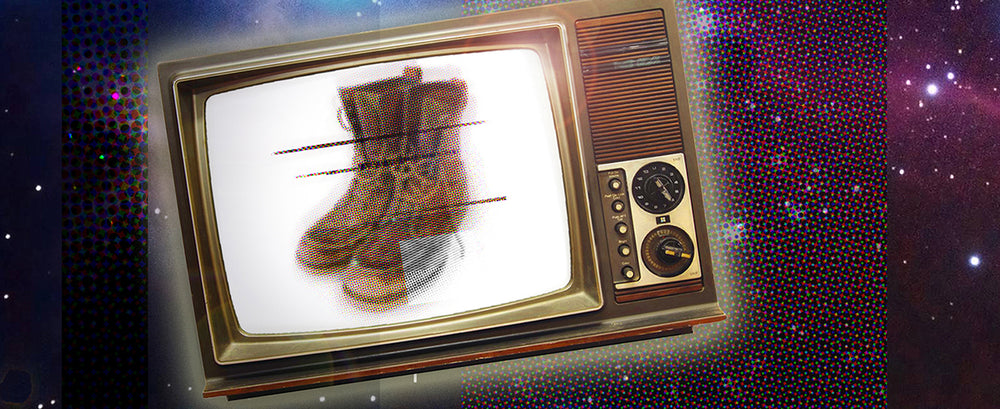 old tv floating in space. leather work boots on screen (artistic image)